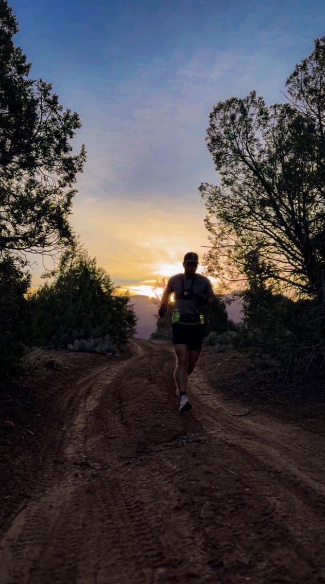Trevor running the trails above Virgin at sunrise