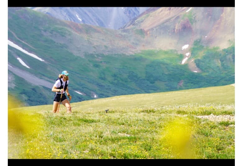 John Bruno running the alpine meadows of the Elk Mountains