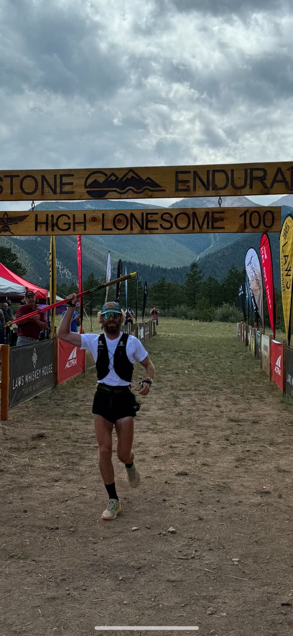 John Bruno crossing the finish line at the High Lonesome 100