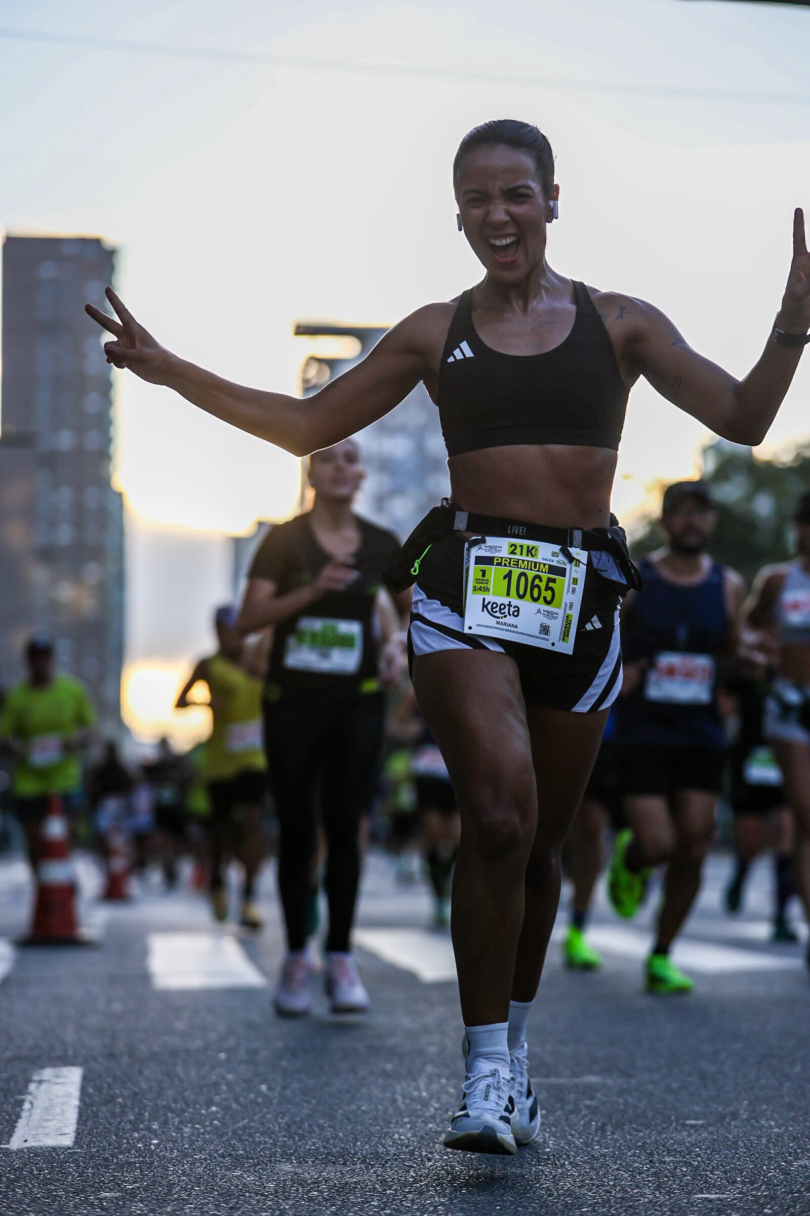 Mari at the finish line of a half marathon in São Paulo