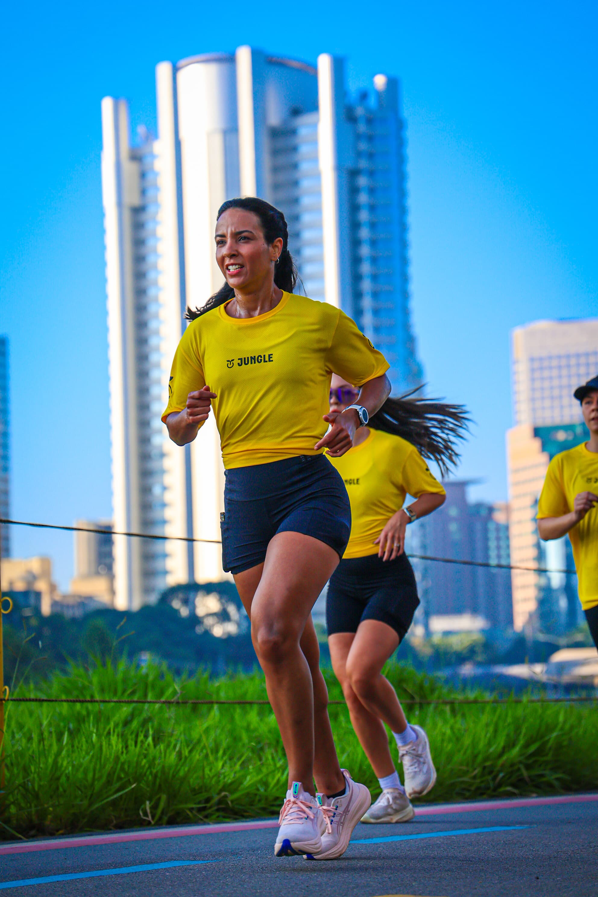 Mari running with her São Paulo running crew in matching kit
